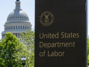 FILE - The entrance to the Labor Department is seen near the Capitol in Washington, Thursday, May 7, 2020. (AP Photo/J.