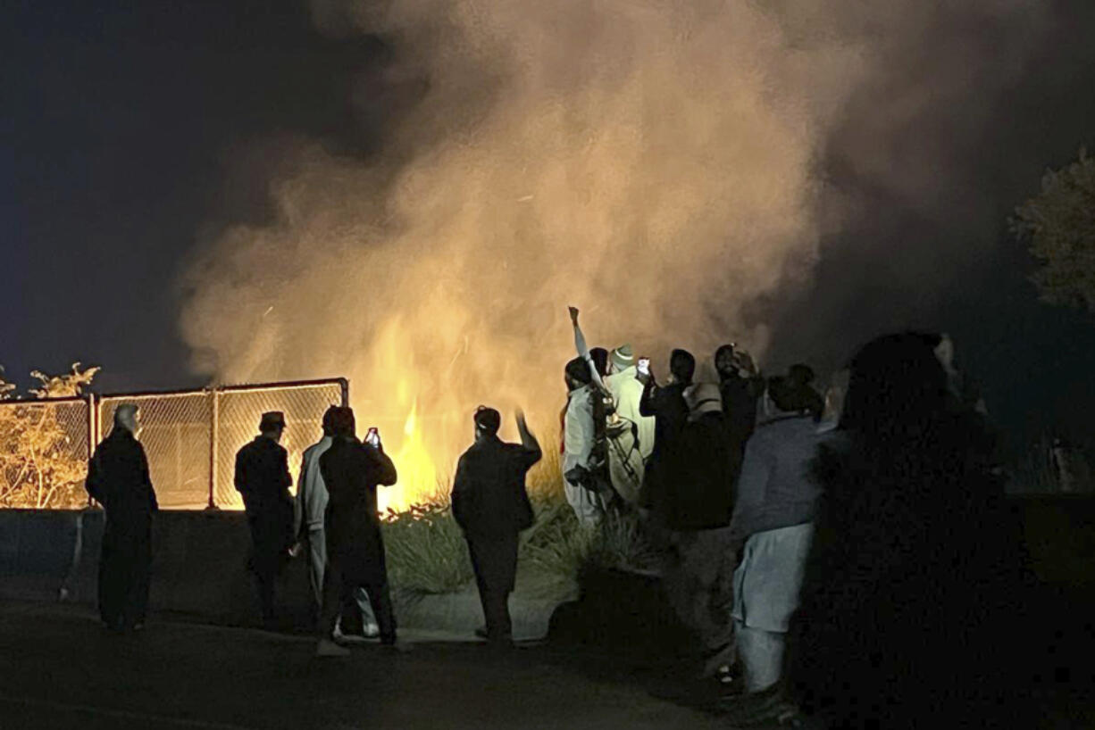 Supporters of imprisoned former premier Imran Khan&#039;s Pakistan Tehreek-e-Insaf party, burn bushes to reduce the impact of tear gas shells fired by police officers to disperse them during a rally demanding Khan&#039;s release, at a motorway in Ghazi in Attock district, Pakistan, Sunday, Nov. 24, 2024.