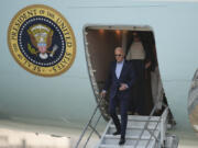 U.S. President Joe Biden deplanes in Lima, Peru, to attend the Asia-Pacific Economic Cooperation (APEC) summit, in Lima, Peru, Thursday, Nov. 14, 2024.