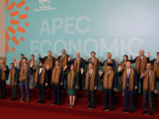 Leaders of the Asia-Pacific Economic Cooperation (APEC) pose for a group photo, in Lima, Peru, Saturday, Nov. 16, 2024.