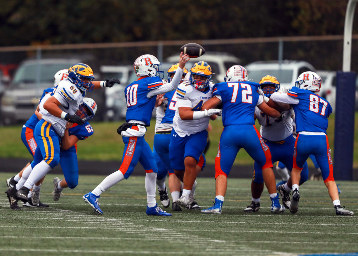 Ridgefield quarterback Landon DeBeaumont throws as pass against Fife in Saturday's 2A state preliminary game. Fife went on to win 34-7.