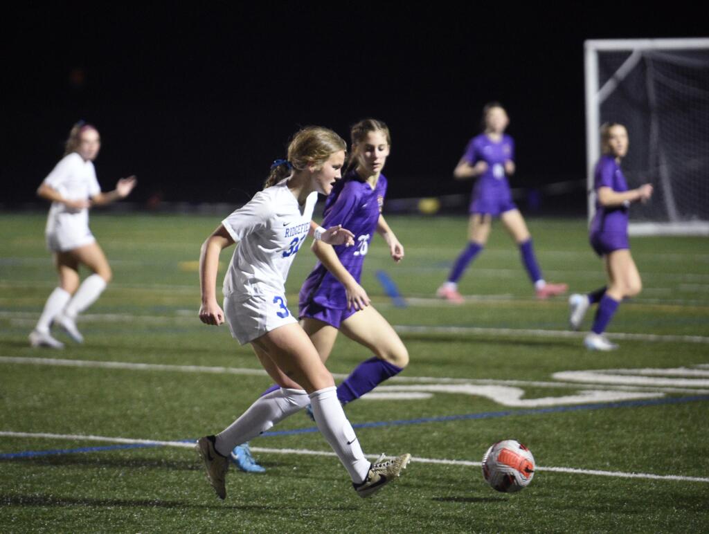 Ridgefield's Savvy Semlick (31) passes the ball against Columbia River during the Class 2A District 4 girls soccer championship game on Saturday, Nov. 9, 2024, at Columbia River High School.