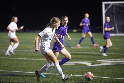 Ridgefield's Savvy Semlick (31) passes the ball against Columbia River during the Class 2A District 4 girls soccer championship game on Saturday, Nov. 9, 2024, at Columbia River High School.