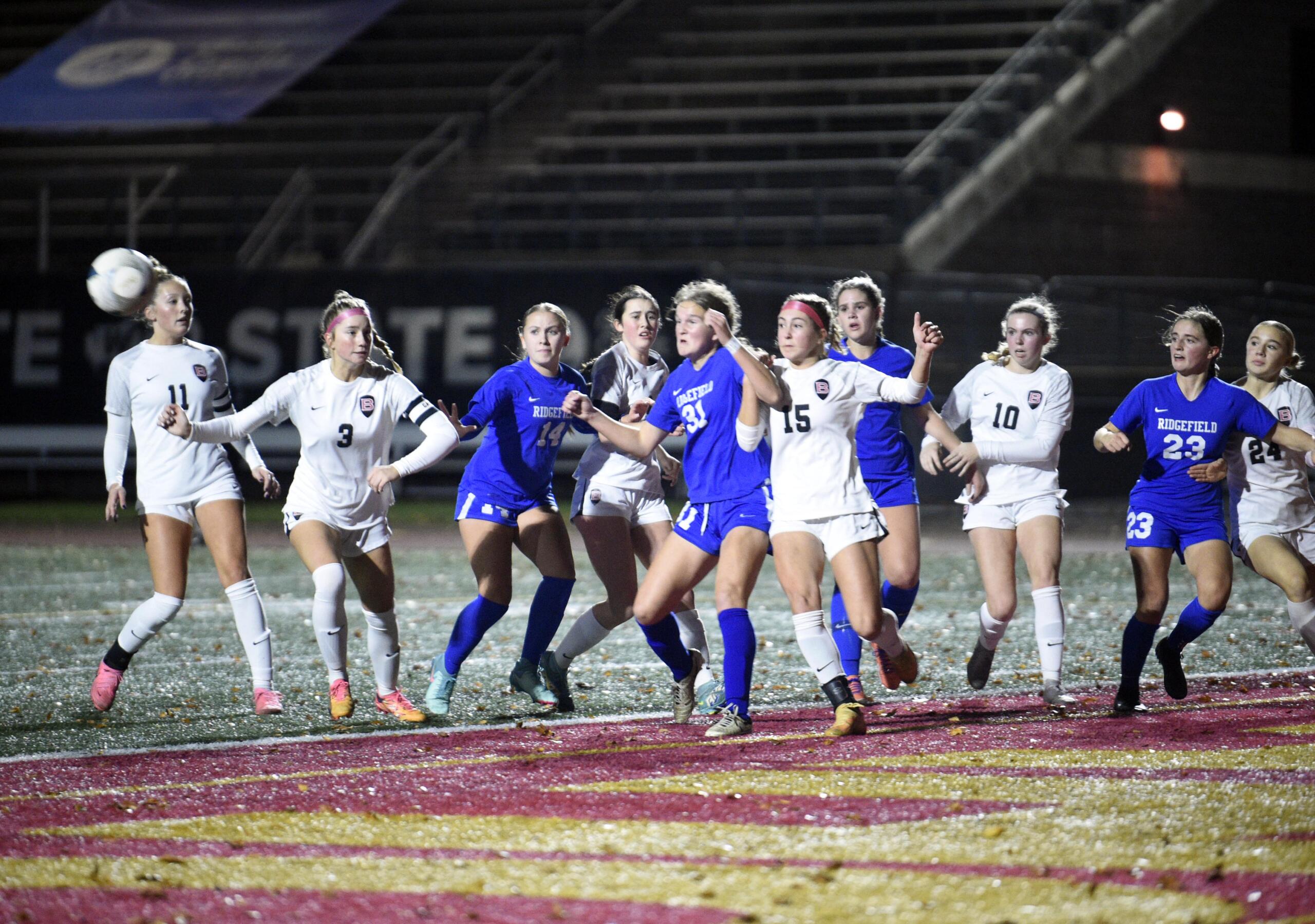 Ridgefield's Savvy Semlick (31) and Bellingham's Grace Gouran (15) battle for position on a corner kick during a Class 2A girls soccer state semifinal game on Friday, Nov. 22, 2024, at Mount Tahoma High School.