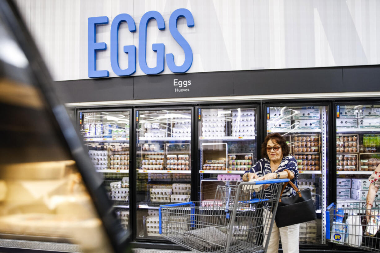 FILE - A woman buys eggs at a Walmart Superstore in Secaucus, New Jersey, on July 11, 2024.