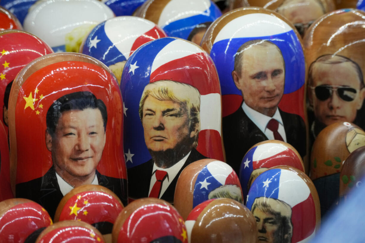 Traditional Russian wooden dolls called Matryoshka depicting China&rsquo;s President Xi Jinping, U.S. President-elect Donald Trump and Russian President Vladimir Putin are displayed for sale at a souvenir shop in St. Petersburg, Russia, Thursday, Nov. 21, 2024.