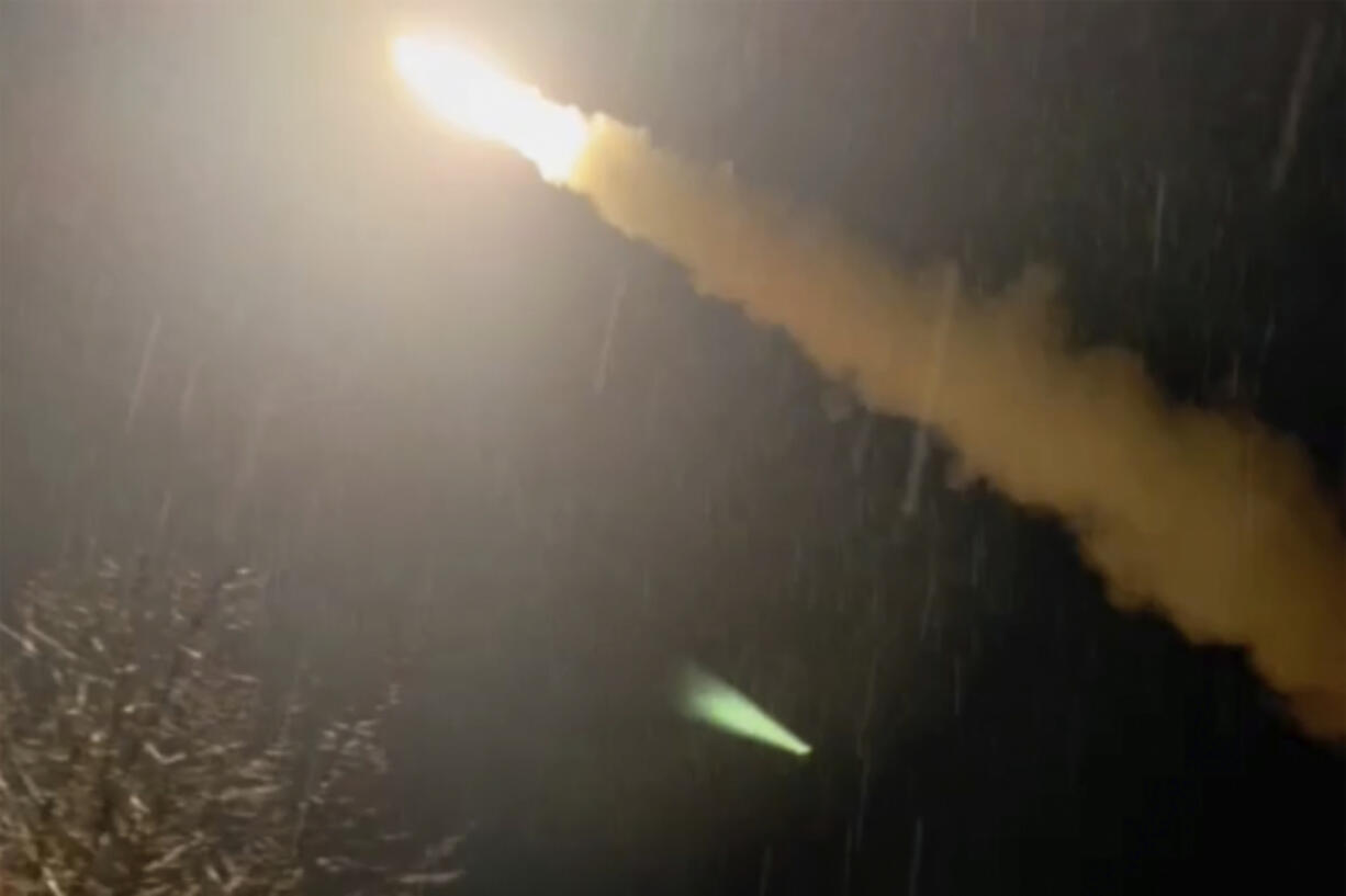 This image was made from a video posted by a Telegram channel affiliated with the Ukrainian military on Tuesday, Nov. 19, 2024. The channel says it shows a U.S.-supplied ATACMS missile being fired from an undisclosed location in Ukraine. The Associated Press cannot independently verify the date and location the video was filmed.