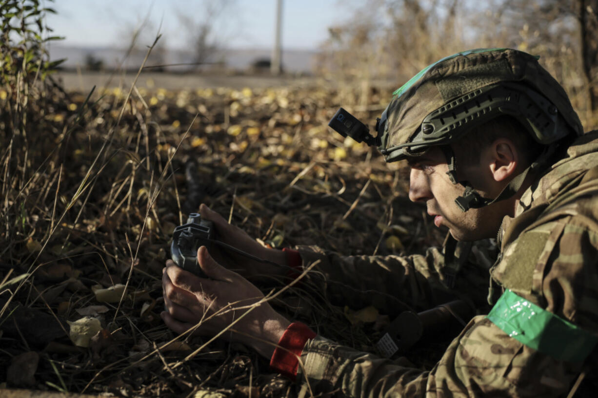 In this photo provided by Ukraine&rsquo;s 24th Mechanised Brigade press service, a serviceman of the 24th Mechanised Brigade installs landmines and non explosive obstacles along the front line near Chasiv Yar town in Donetsk region, Ukraine, Wednesday Oct. 30, 2024.