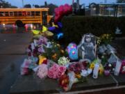 A photo of Alexandria Bell rests amid a memorial to the victims of a school shooting at Central Visual and Performing Arts High School in St. Louis on Oct. 25, 2022. (Robert Cohen/St.