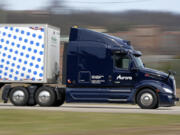 FILE - A self-driving tractor trailer maneuvers around a test track in Pittsburgh, Thursday, March 14, 2024. The truck is owned by Pittsburgh-based Aurora Innovation Inc. (AP Photo/Gene J.