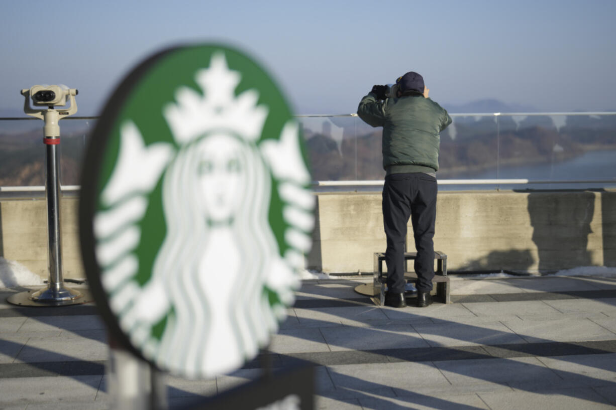 A visitor watched North Korean side at the observatory of the Aegibong Peace Ecopark in Gimpo, South Korea, Friday, Nov. 29, 2024.