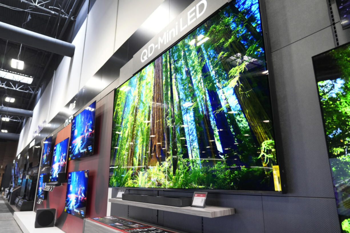 A 115-inch TCL television, right, is displayed at a Best Buy store in Dallas, Friday, Oct. 25, 2024.