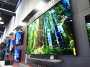 A 115-inch TCL television, right, is displayed at a Best Buy store in Dallas, Friday, Oct. 25, 2024.