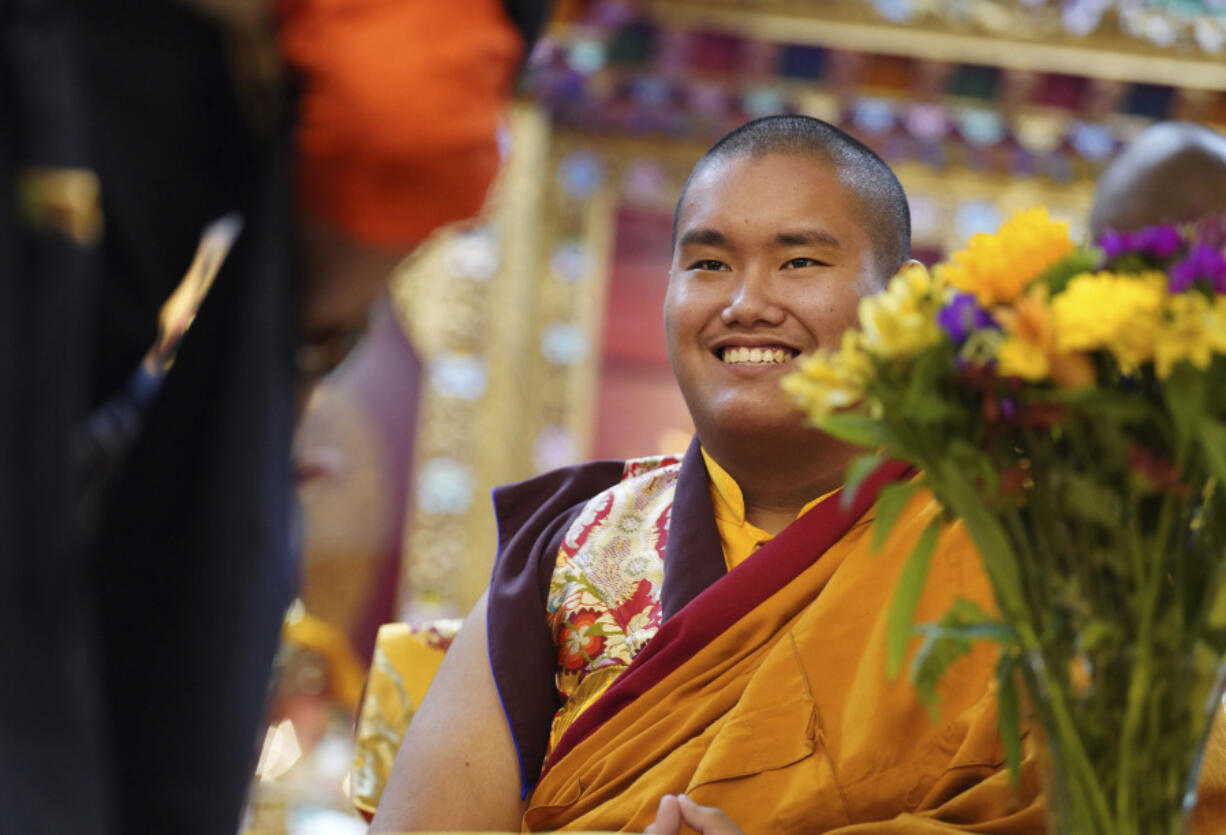 U.S.-born Buddhist lama, Jalue Dorje, is presented with &ldquo;khata,&rdquo; the Tibetan ceremonial scarves that symbolize auspiciousness, at his 18th birthday and enthronement ceremony, in Isanti, Minn., on Nov. 9.