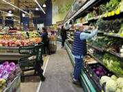 FILE - Customers shop at a grocery store in Chicago, Oct. 25, 2024. (AP Photo/Nam Y.