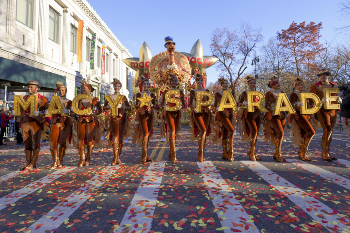 FILE - Parade performers lead the Tom Turkey float down Central Park West at the start of the Macy&#039;s Thanksgiving Day parade on Nov. 23, 2023, in New York.