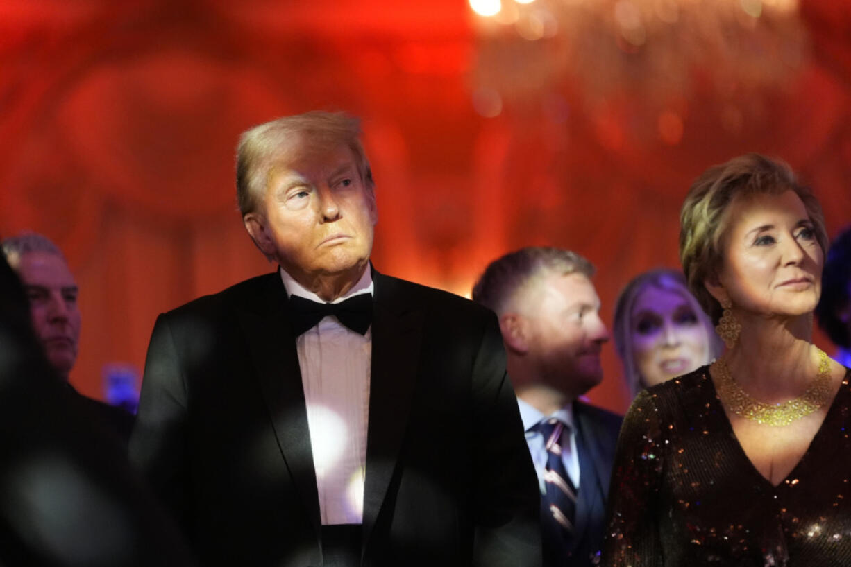 President-elect Donald Trump listens with Linda McMahon during an America First Policy Institute gala at his Mar-a-Lago estate, Thursday, Nov. 14, 2024, in Palm Beach, Fla.