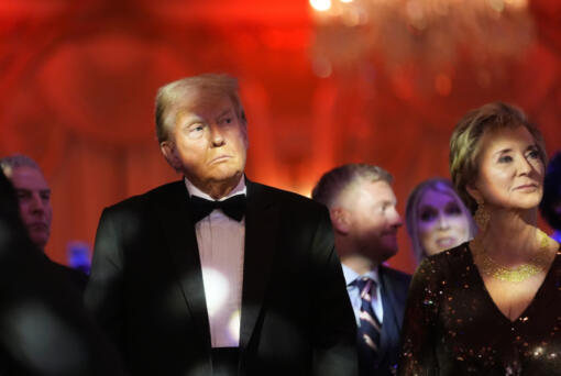 President-elect Donald Trump listens with Linda McMahon during an America First Policy Institute gala at his Mar-a-Lago estate, Thursday, Nov. 14, 2024, in Palm Beach, Fla.