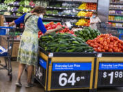 FILE - People buy groceries at a Walmart Superstore in Secaucus, New Jersey, July 11, 2024.