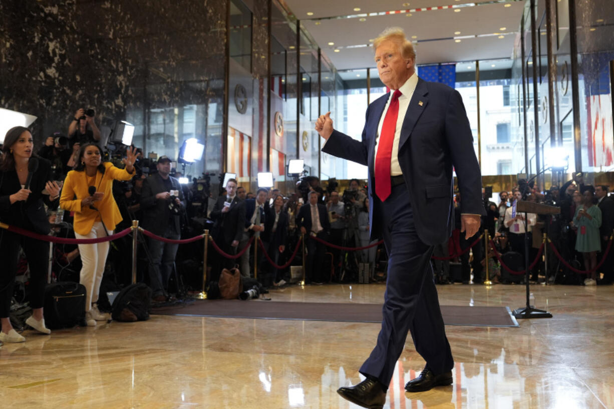 FILE - Former President Donald Trump gestures as he leaves after speaking at a news conference at Trump Tower, Friday, May 31, 2024, in New York.