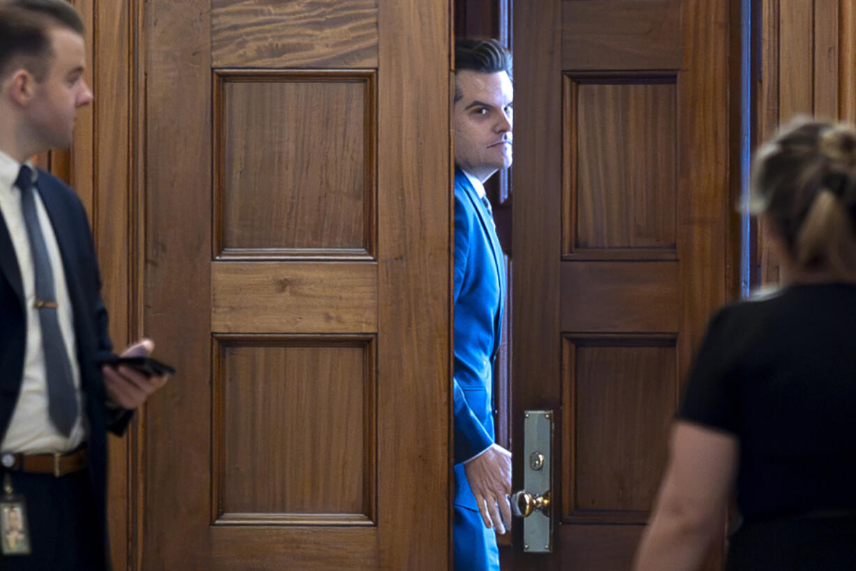 FILE - President-elect Donald Trump&#039;s nominee to be attorney general, former Rep. Matt Gaetz, R-Fla., closes a door to a private meeting with Vice President-elect JD Vance and Republican Senate Judiciary Committee members, at the Capitol in Washington, Nov. 20, 2024. (AP Photo/J.