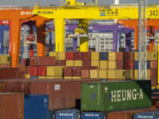 FILE - Shipping containers are stacked at a port in Tianjin, China, Jan. 16, 2023.