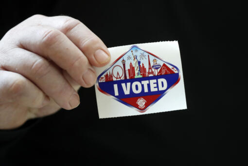 A voter displays an &ldquo;I Voted&rdquo; sticker during the first day of early voting at the Galleria at Sunset mall Saturday, Oct. 19, 2024, in Henderson, Nev.