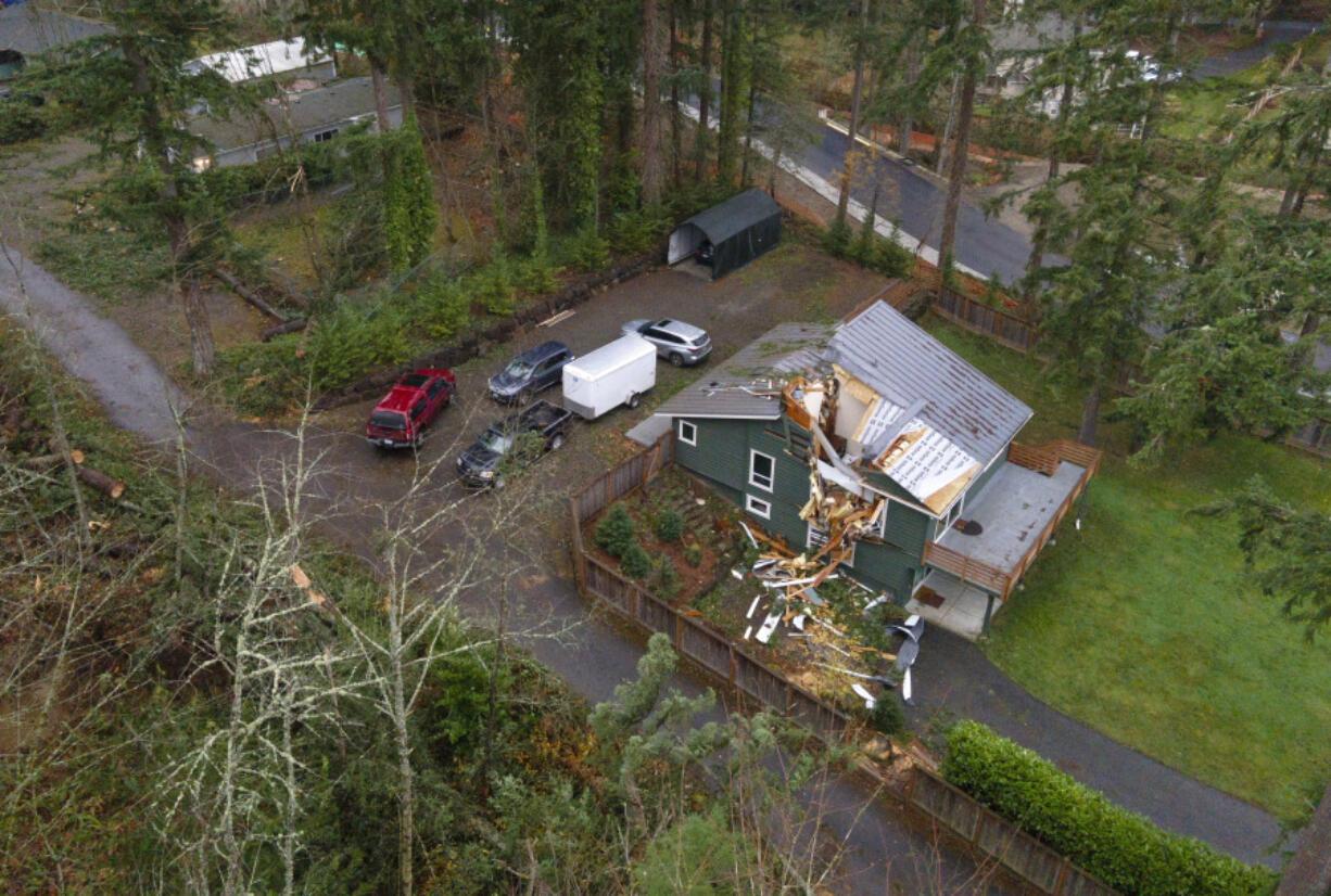 The roof of a house remains damaged on Sunday, Nov. 24, 2024, in Sammamish, Wash., after last week&rsquo;s &ldquo;bomb cyclone&rdquo; wreaked havoc throughout Western Washington.