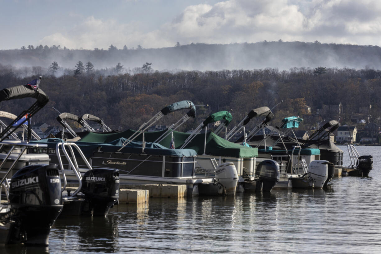 Smoke rises from a wildfire in a forested mountain area across from Greenwood Lake Monday in Lakeside, N.J..