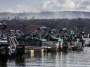 Smoke rises from a wildfire in a forested mountain area across from Greenwood Lake Monday in Lakeside, N.J..