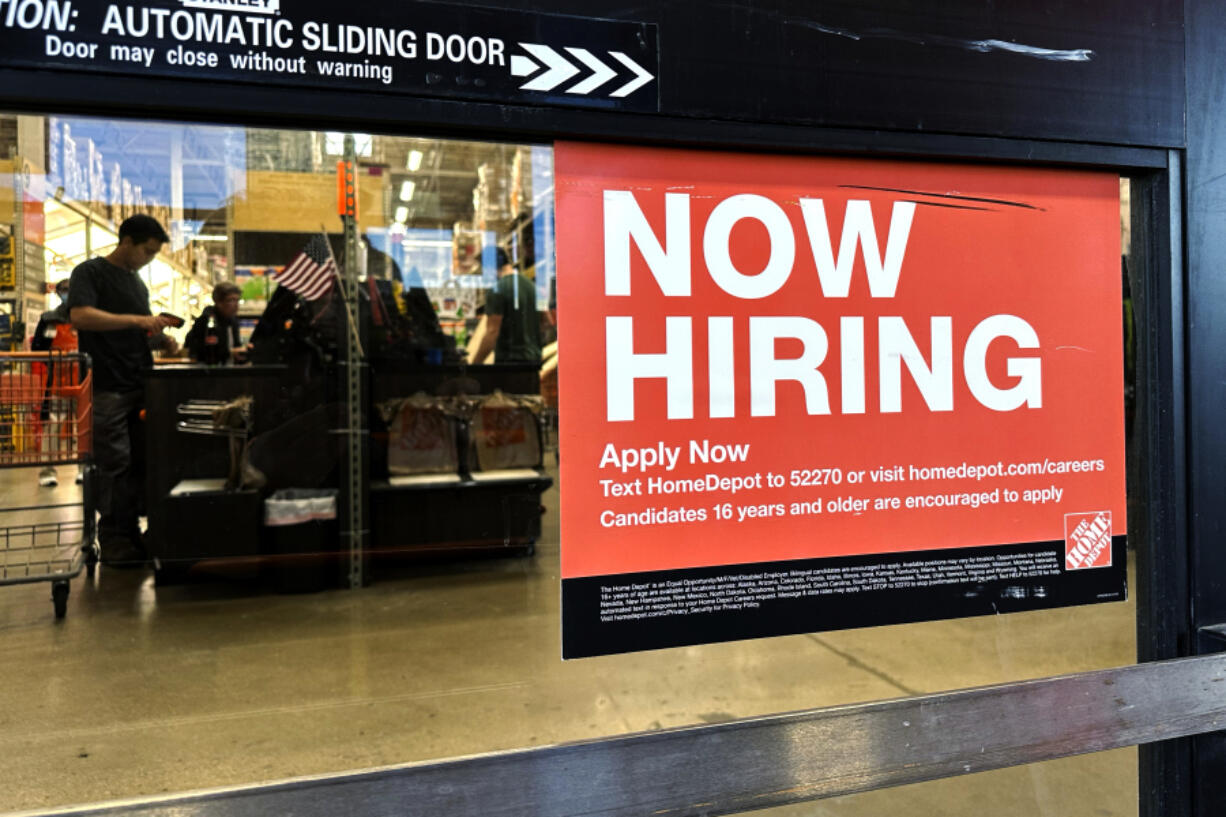 A hiring sign is displayed at a retail store in Mount Prospect, Ill., Saturday, Nov. 2, 2024. (AP Photo/Nam Y.