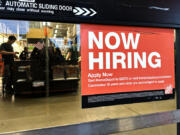 A hiring sign is displayed at a retail store in Mount Prospect, Ill., Saturday, Nov. 2, 2024. (AP Photo/Nam Y.