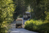 Trucks drive toward the Zimmerly gravel pit near Washougal in 2018.