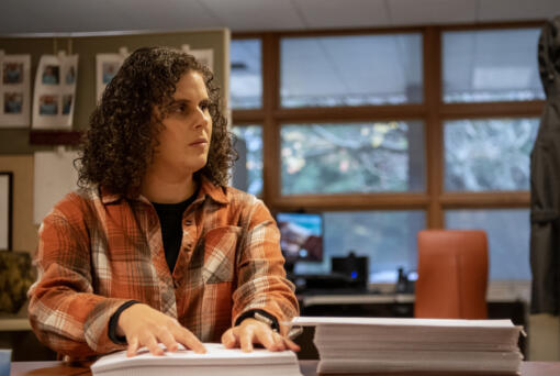 Braille proofreader Adrienne Libby checks over a novel Wednesday at the Ogden Resource Center.