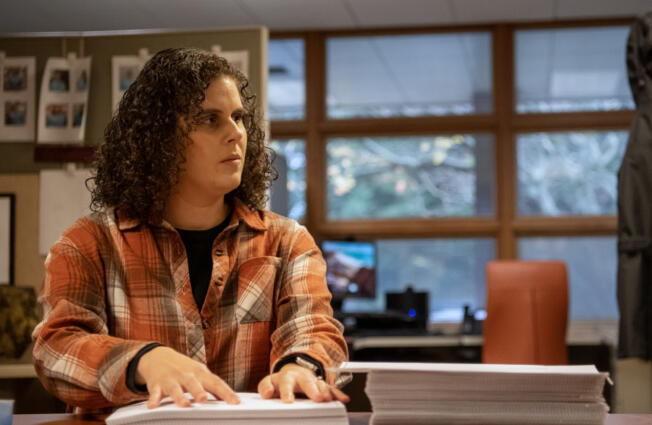 Braille proofreader Adrienne Libby checks over a novel Wednesday at the Ogden Resource Center.