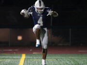 Seton Catholic&rsquo;s Jacob Williams (4) celebrates after scoring a touchdown during the Cougars&rsquo; win against Montesano.