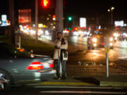 Christie Deford of Vancouver waits for the light to change so that she can cross the intersection at Fourth Plain Boulevard and 117th Avenue, a journey she makes at least twice a day going to and from work. The area has been a hot spot for cars striking pedestrians and officials warn to practice good road safety.