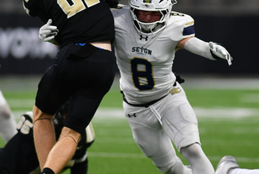 Seton Catholic senior Garrett Nebels (8) forces a fumble from Royal’s Jackson Larsen (21) on Friday, Dec. 6, 2024, during Seton’s 61-28 loss to Royal in the WIAA 1A State Football Championship at Husky Stadium in Seattle.