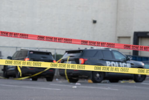 Law enforcement officers investigate a shooting at the Cascade Park Safeway store on Thursday morning, Dec. 5, 2024. Vancouver police shot and killed a man Wednesday night after he physically attacked a police officer, according to a statement from the agency.