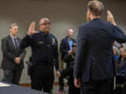 Chief Troy Price, second from left, is sworn in as Vancouver&rsquo;s next police chief Monday afternoon at Vancouver City Hall. Price has been with the Vancouver Police Department since 1997 and worked his way up the ranks from patrol officer.