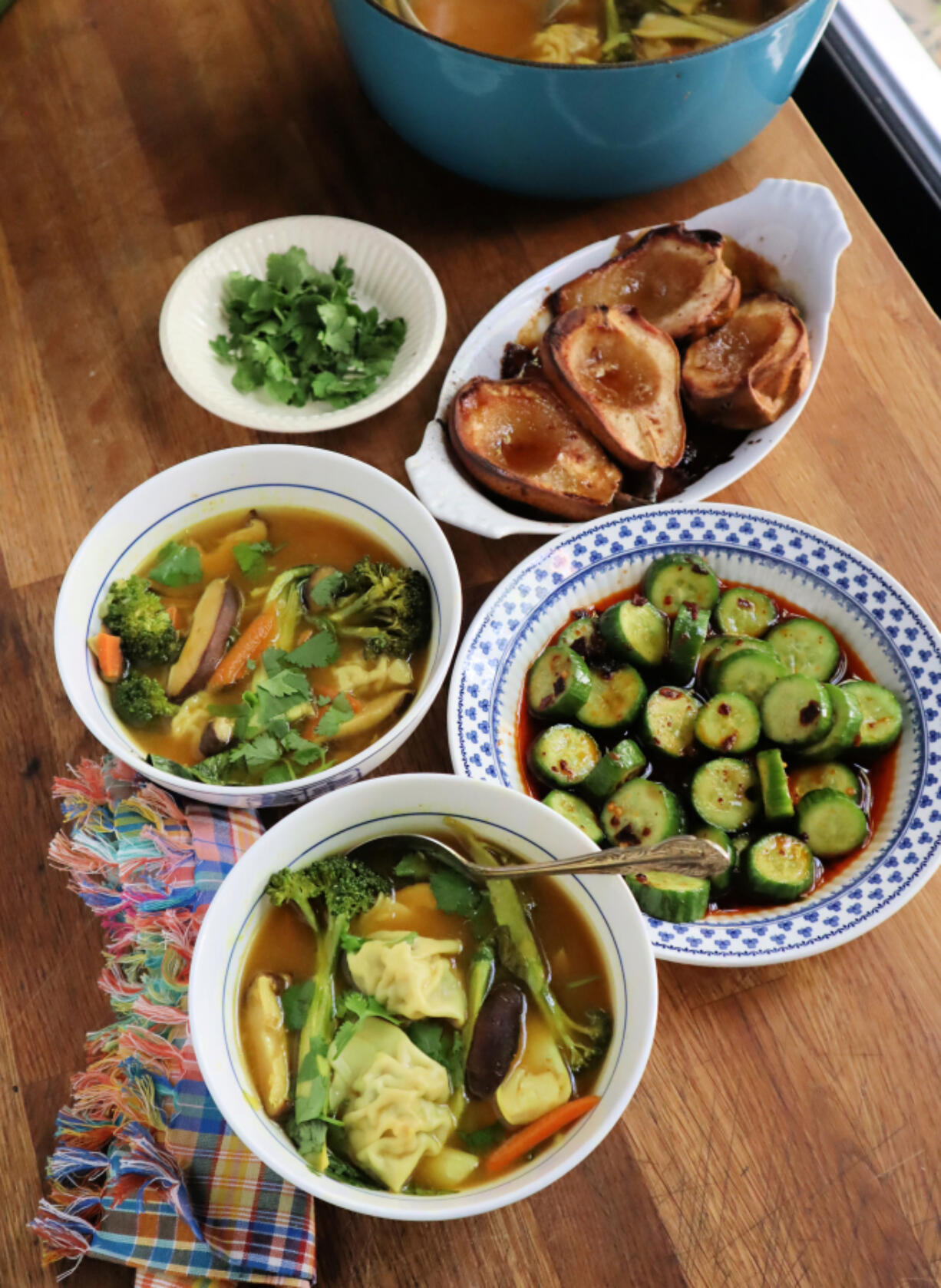 This $15 dinner for two includes Asian cucumber salad, a hearty wonton soup and baked pears with maple for dessert.