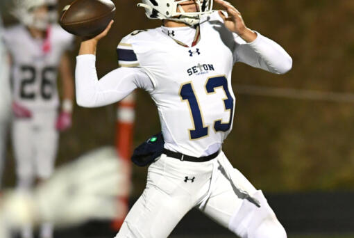 Seton Catholic junior Kolten Gesser throws the ball Friday, Oct. 11, 2024, during the Cougars&Igrave; 49-12 win against Kalama at Kalama High School.