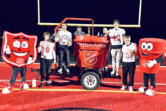 Camas High School football players Ryan Criddle, from left, Jake Davidson, Jaxon Goode and Titan Brodie celebrate after winning the 2024 Camas-Washougal Salvation Army Red Kettle Kickoff on Nov. 25 at Camas High School.