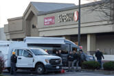 Law enforcement officers investigate a shooting at the Cascade Park Safeway store on Thursday morning. Vancouver police shot and killed a man Wednesday night after he physically attacked a police officer, according to a statement from the agency.