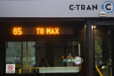 A C-Tran bus stops at the Fisher&rsquo;s Landing Transit Center in 2022 before taking commuters to the Parkrose/Sumner Transit Center in Portland so they can board a MAX light rail train. C-Tran staff said Tuesday the agency expects the cost of operating a MAX extension into downtown Vancouver and adding express buses will cost $21.8 million in its first year of operation.