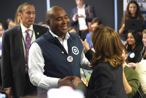 Democratic presidential nominee Vice President Kamala Harris, right, greets DNC Chair Jaime Harrison after phone banking with volunteers at the DNC headquarters on Election Day, Tuesday, Nov. 5, 2024, in Washington.