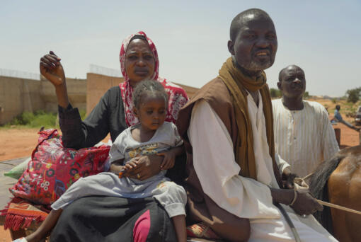 Ousmane Taher and his family cross from Sudan into Chad near Acre Sunday, Oct 6. 2024.