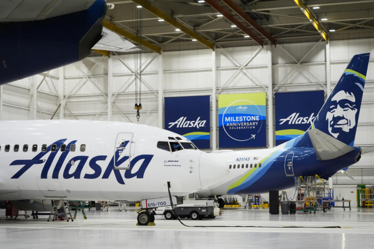 FILE - Alaska Airlines aircraft sits in the airline&#039;s hangar at Seattle-Tacoma International Airport, Jan. 10, 2024, in SeaTac, Wash.