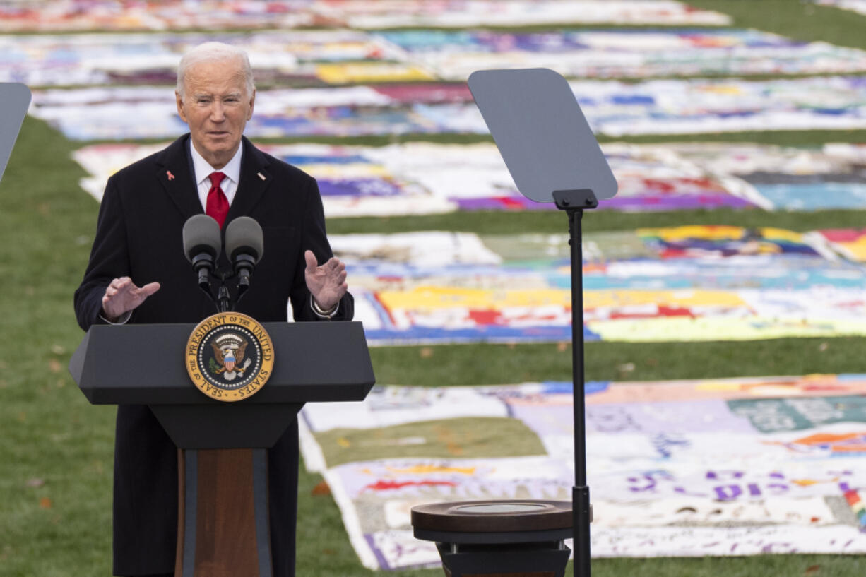 President Joe Biden speaks on the South Lawn of the White House during a ceremony to commemorate World AIDS Day with survivors, their families and advocates, Sunday, Dec. 1, 2024, in Washington.