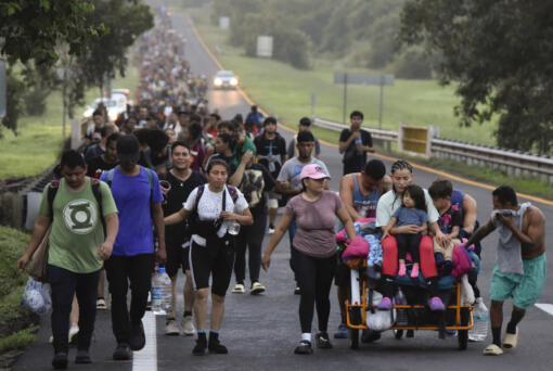 Migrants walk along the Huixtla highway in the state of Chiapas, Mexico, Oct. 22, 2024, hoping to reach the country&#039;s northern border and ultimately the United States. (AP Photo/Edgar H.